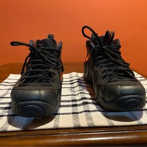Nike foamposite dark green with black  soles and orange trim size 10.5